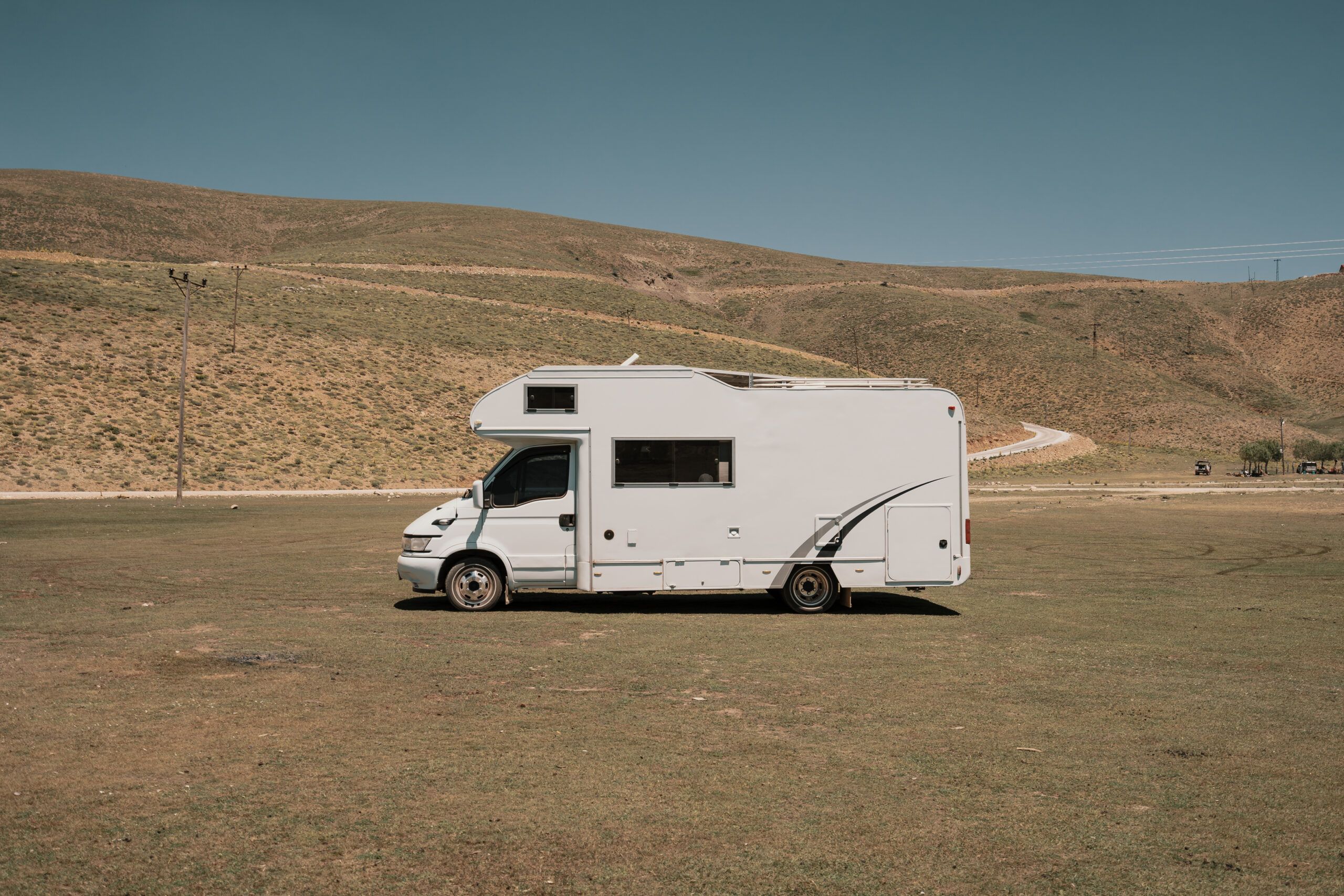 House on wheels. RV - recreational vehicle trailer on camping in the mountains